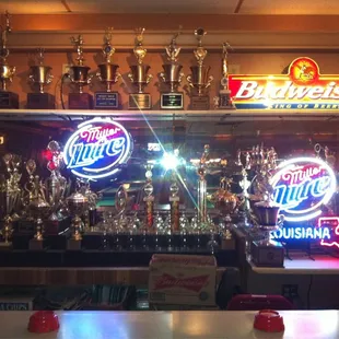a display of beer and trophies