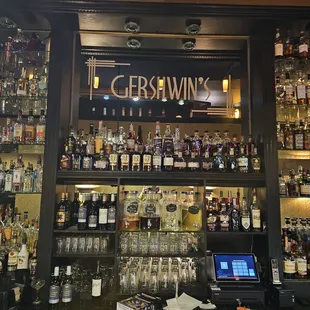 a bar with many bottles of alcohol