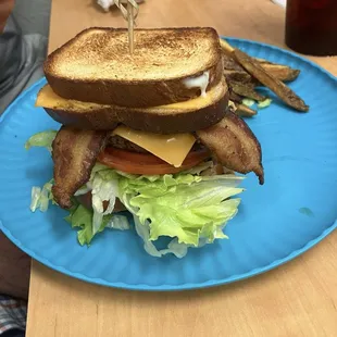 Grilled cheese burger with lettuce and tomato