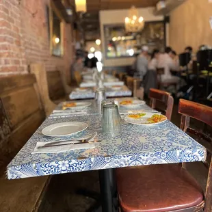 a table with plates and utensils on it