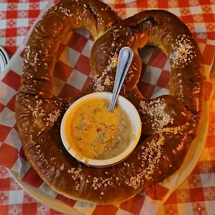 Giant pretzel w cheese sauce for dipping.