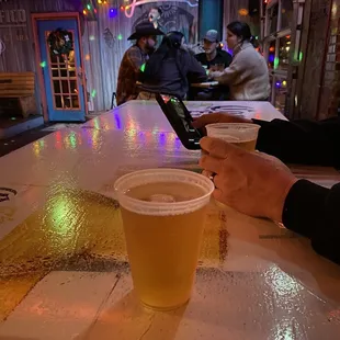 two people sitting at a bar