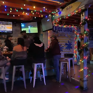 people sitting at a bar