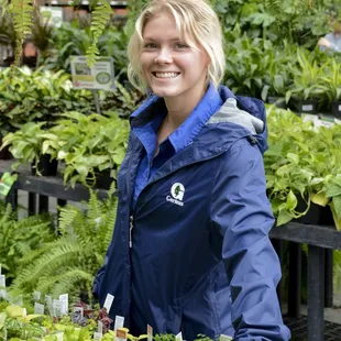 a woman standing in a garden center