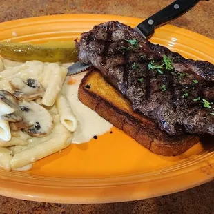 Steak Sandwich with a mushroom alfredo pene