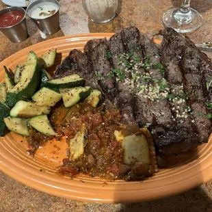 Ribeye, raviolis and steamed vegetables everything cooked to perfection