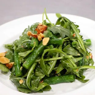 Arugula salad with asparagus and toasted almonds.