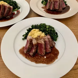 NY strip with red wine reduction, polenta and sautéed kale.