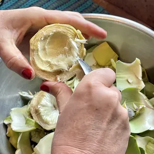 Prepping the artichoke.