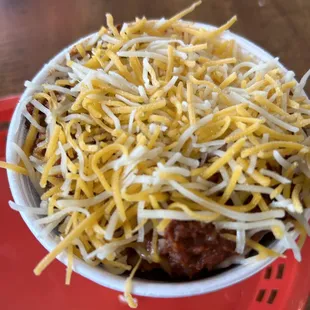 Cup of chili with cheese