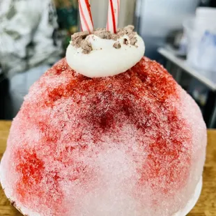 a candy cane on top of a cake