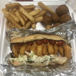 shrimp Po Boy with fries and hush puppies.