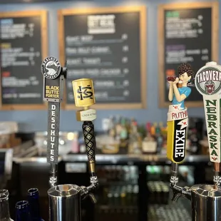 a row of beer taps