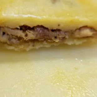 Up close with the spicy shredded pork tamale.