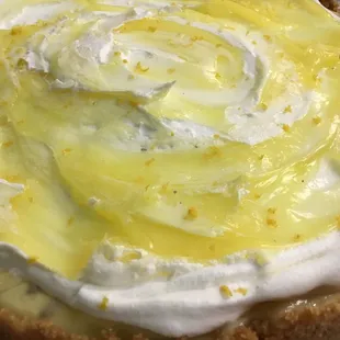 a lemon pie with whipped cream