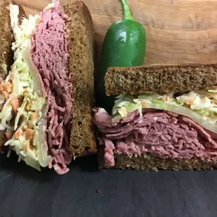 a roast beef sandwich with coleslaw