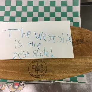 a sign on a wooden board