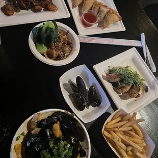 Mussels, fries( top tier), rangoons, 2 varieties of dumplings &amp; spicy noods