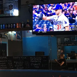 Dodgers game, happy hour menu, and bartop.