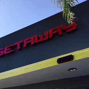 the neon sign on the building