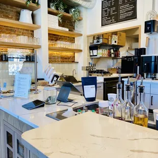 a counter with a laptop on it