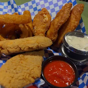 a basket of fried fish and fries