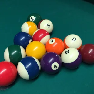 pool balls arranged in a triangle