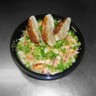 Salmon Flake Bowl White Rice, Shredded Grilled Salmon, Green Onions, Bonito Fish Flakes, and 3 pieces of Gyoza.