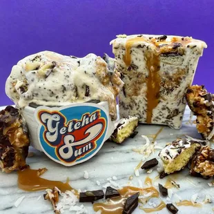 a cup of ice cream with a bite taken out of it