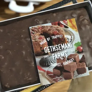 a hand holding a box of chocolate