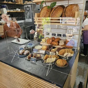 Pastries and co-owner at register