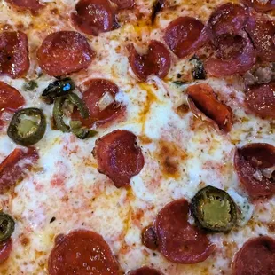 Pepperoni, jalapeno, and onion pizza