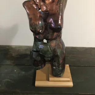 This is a woman's torso clay sculpture from Bob Hasselle from the rock Hill pottery gallery. The firing colors are incredible.