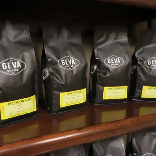 five bags of geva coffee on a shelf