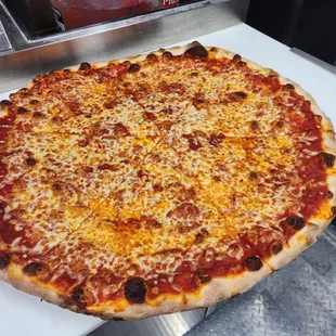 a large pizza with cheese and pepperoni