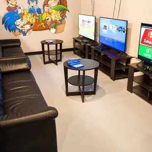 a living room with a couch, coffee table, and television