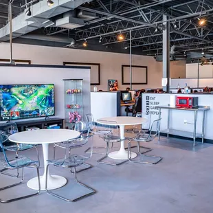 a game room with a tv and a bar