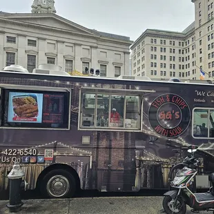 a motorcycle parked in front of a food truck