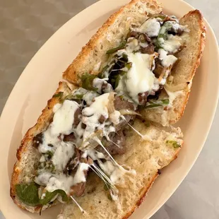 Philly Cheesesteak with bell pepper, onion, mushrooms and cheese.