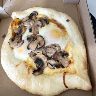 Egg boat with mushrooms.