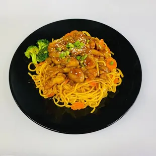 a black plate with noodles and broccoli