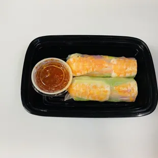 a plate of sushi rolls