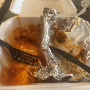 a fork sticking out of the tin foil