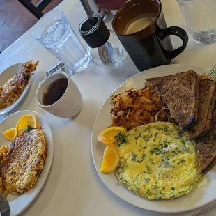 L: Western Omelette with tea ; R: Fresh Herb &amp; Goat Cheese Omelette with a hazelnut latte