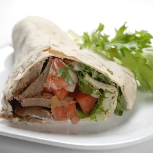 a wrap of meat and vegetables