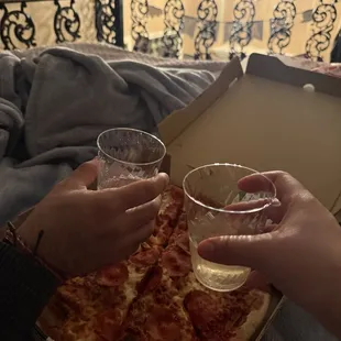 Pepperoni Pizza to-go on New Years Eve. Dive bar pizza, would definitely get it again! 1/1/2025