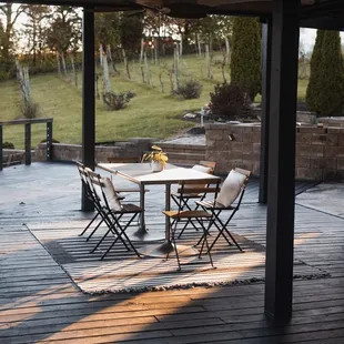 a patio with a table and chairs