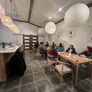 a group of people sitting at tables