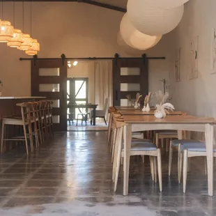a dining room with a table and chairs