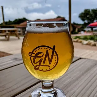 a glass of beer on a table